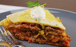 Featured image for Layered Slow Cooker Beef Enchiladas