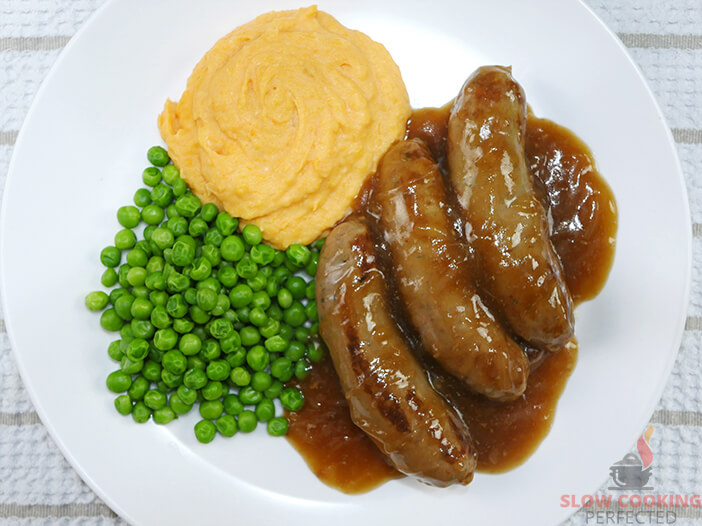 Sausages and Onion Gravy with Peas and Mashed Potato