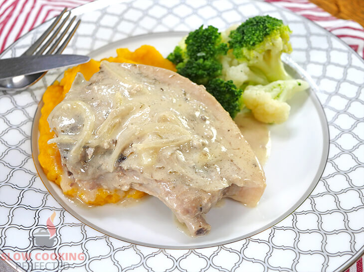 Smothered Pork Chops with mashed sweet potatoes and broccoli