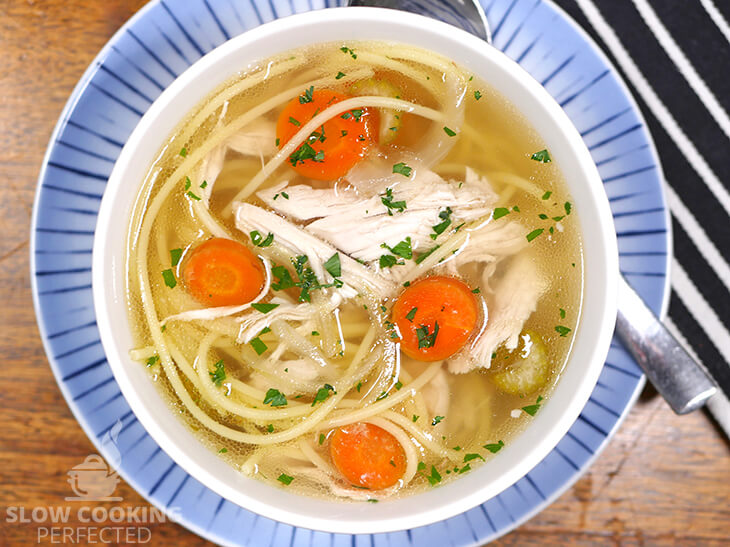 Healthy Chicken Noodle Soup topped with parsley