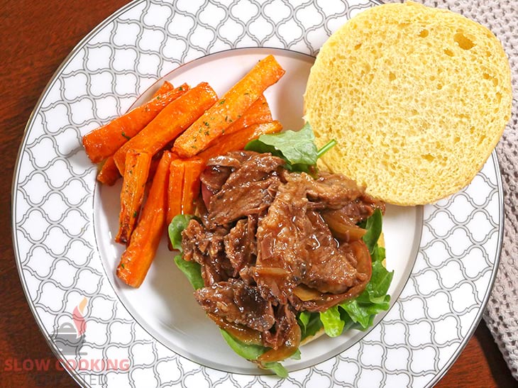 Slow-cooked BBQ Beef on a bread roll with lettuce